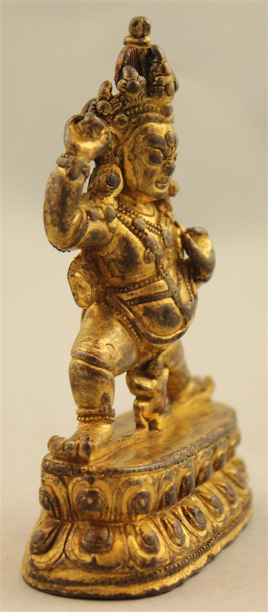 A Tibetan gilt copper bronze figure of Mahakala, 18th / 19th century, 10.5cm.